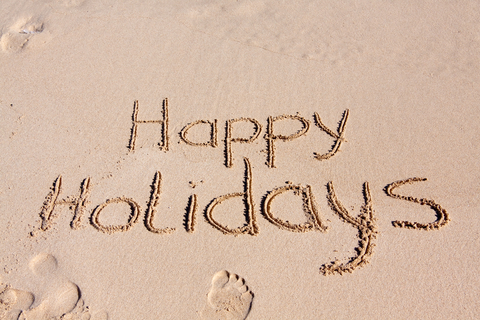 Happy Holidays from Customers That Stick | Happy Holidays Written in Sand